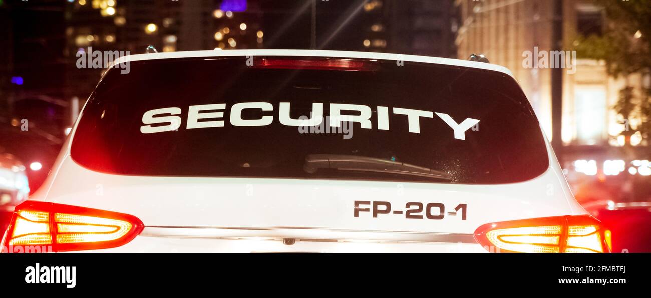 Security company car operating to patrol the city Stock Photo Alamy