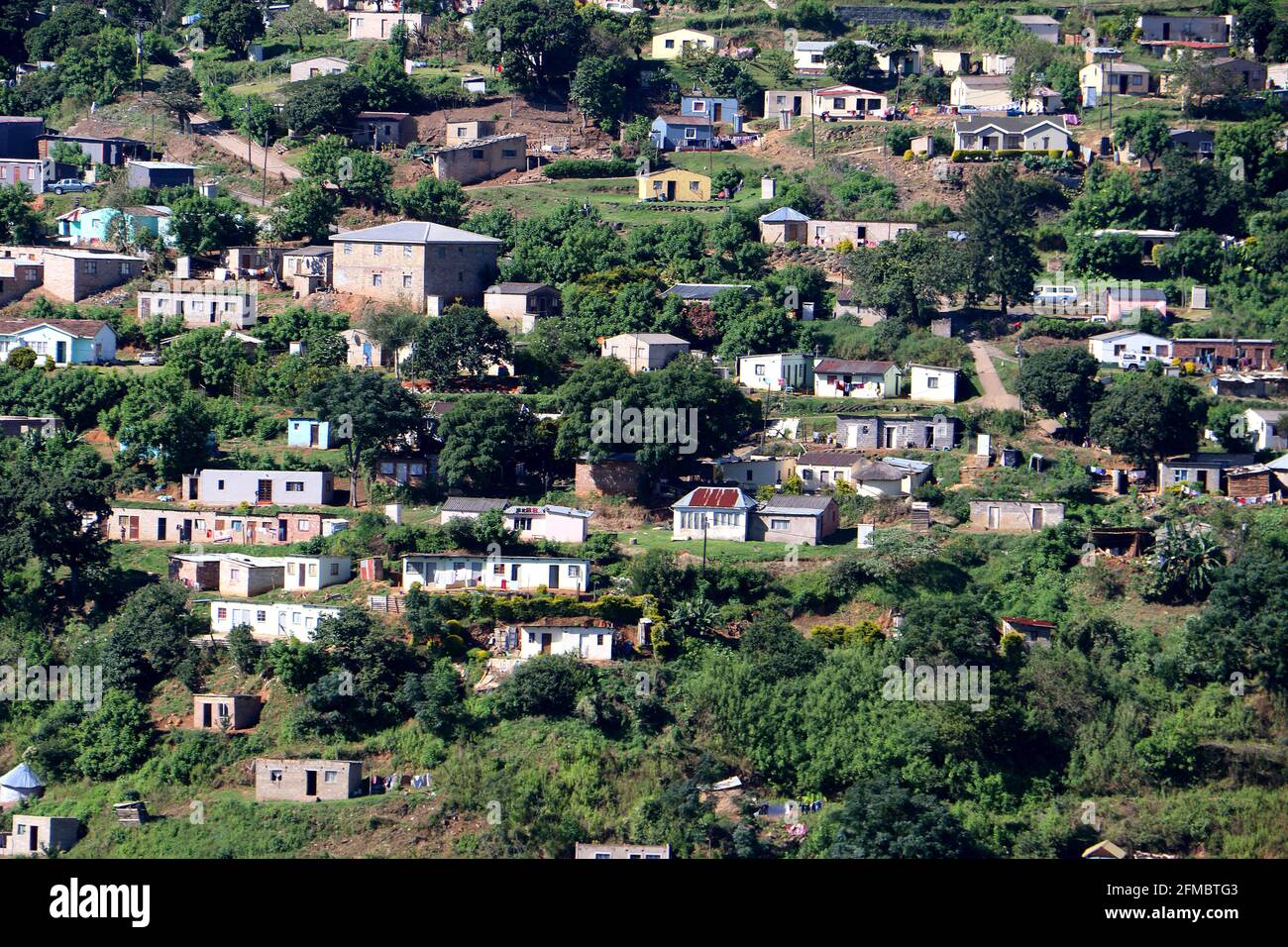 Poor rural South African Settlement on hillside in KwaZulu Natal Stock Photo
