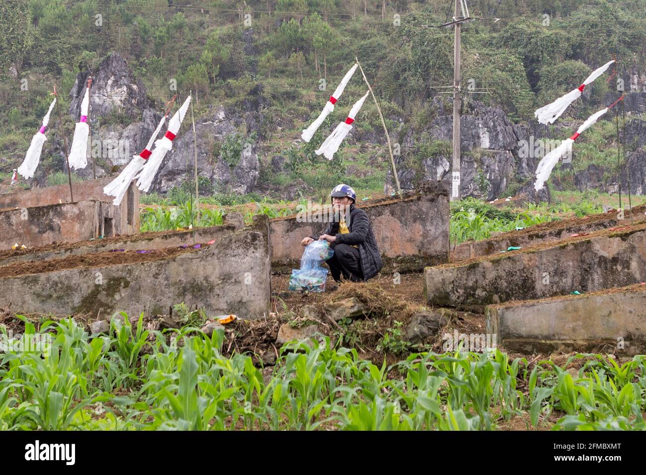 Annual visiting ancestors graves bearing gifts and lighting fires in