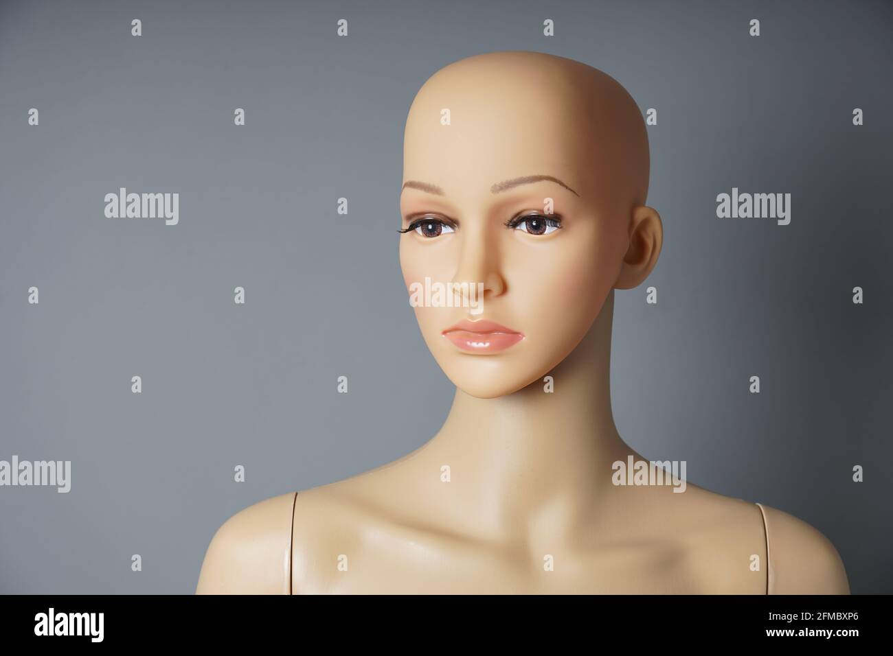 shop window mannequin or display dummy with bald head and naturalistic face Stock Photo