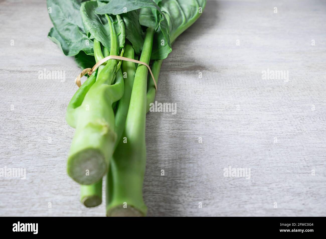 Vegetable Chinese kale on white background Stock Photo Alamy
