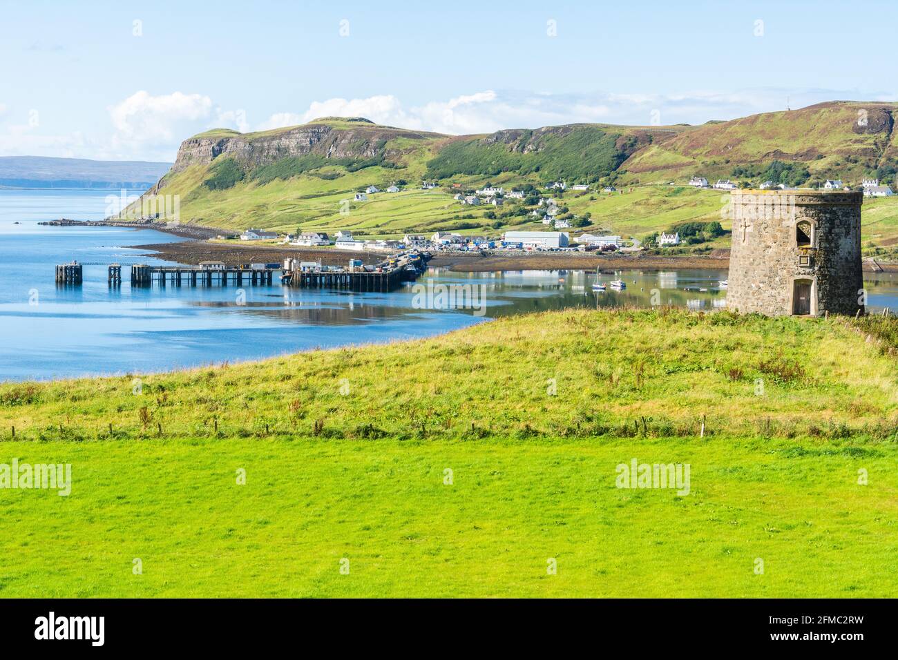 View over Uig harbour, pier and tower in the Isle of Skye in Scotland. Stock Photo