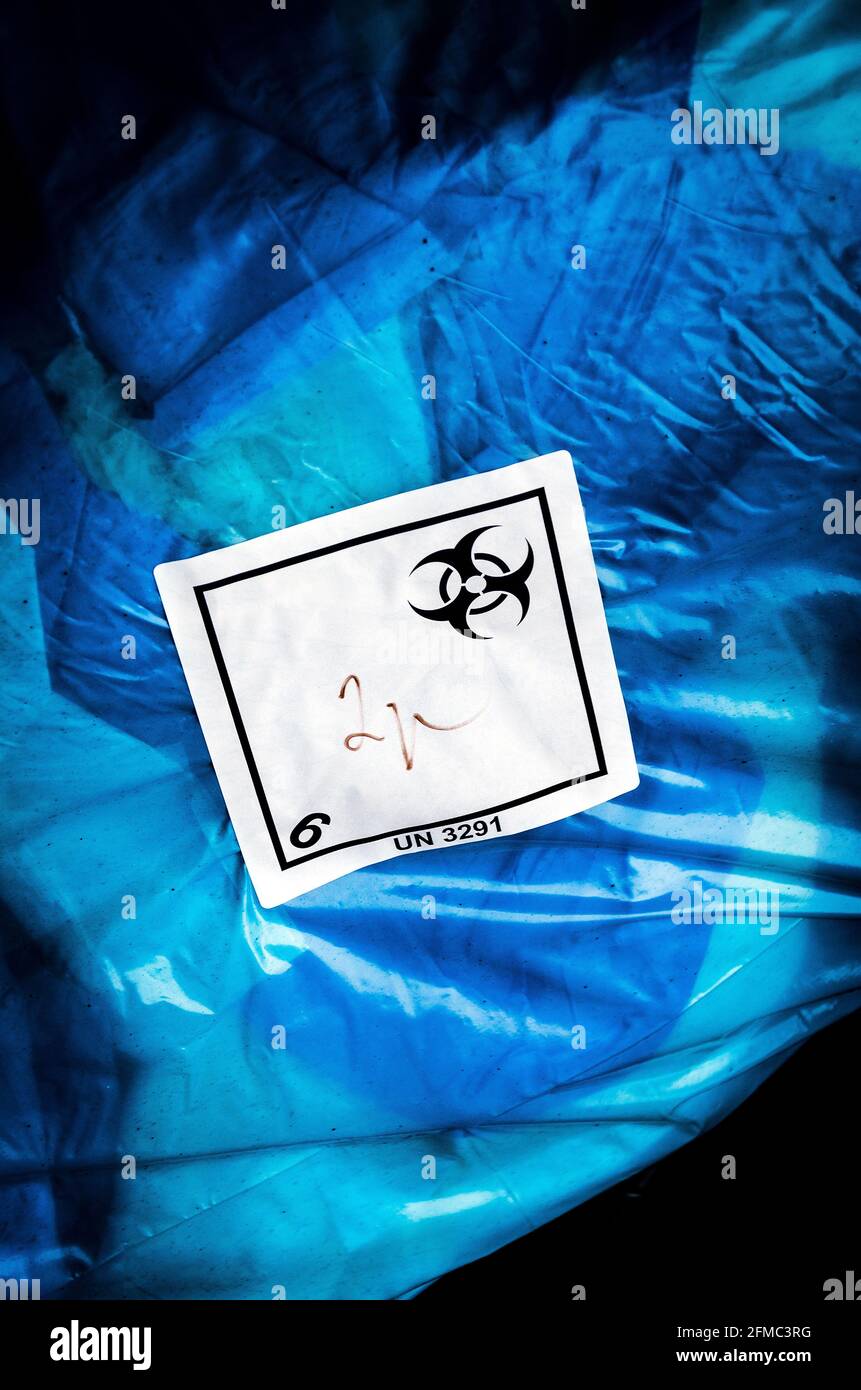 Biohazard waste plastic blue bag with sticker logo, hospital waste Stock Photo