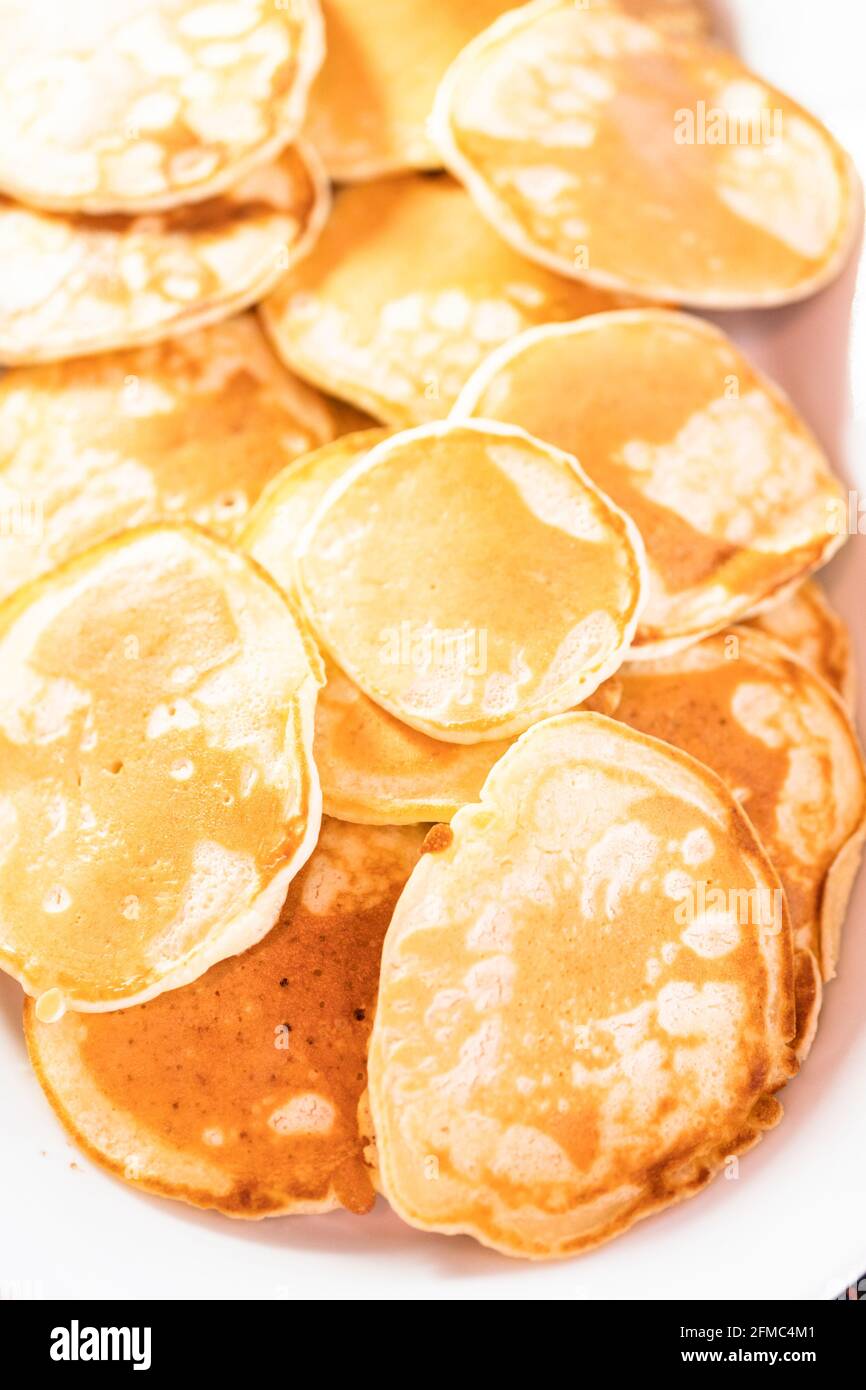 Freshly made small pancakes on a kefir base. Stock Photo