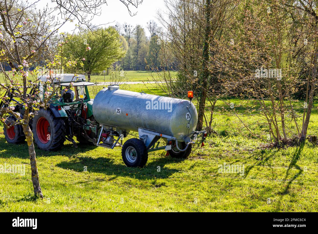 tank-truck-for-irrigation-of-fruit-trees-stock-photo-alamy