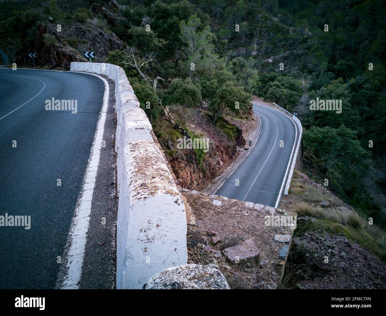 Mountain road at different levels with bollards Stock Photo