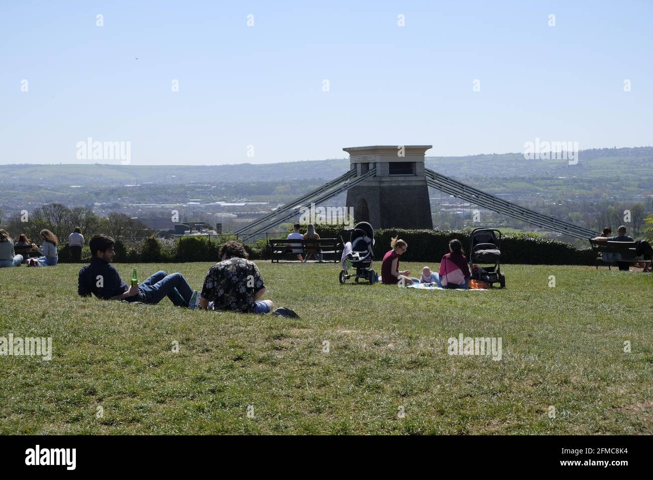 Bristol, UK- April 2021: Friends and families enjoy drinks and picnicking at the Clifton Down in Bristol, near the Clifton Suspension Bridge Stock Photo