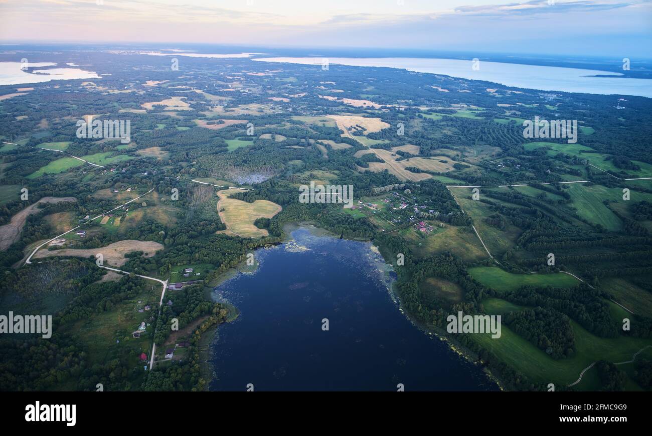 Landscape with pink sunset and lakes aerial above top view Stock Photo