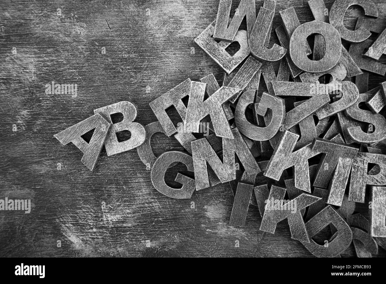 Pile of old vintage wooden letters. Typography background composition. Stock Photo