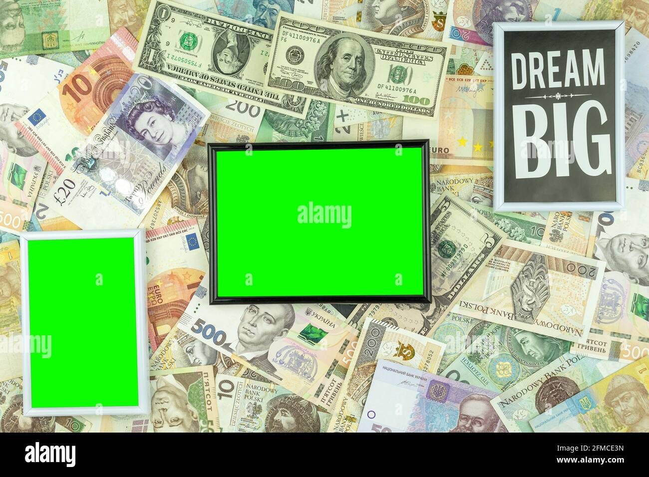 Banknotes of different denominations are scattered on the table. Wish ...