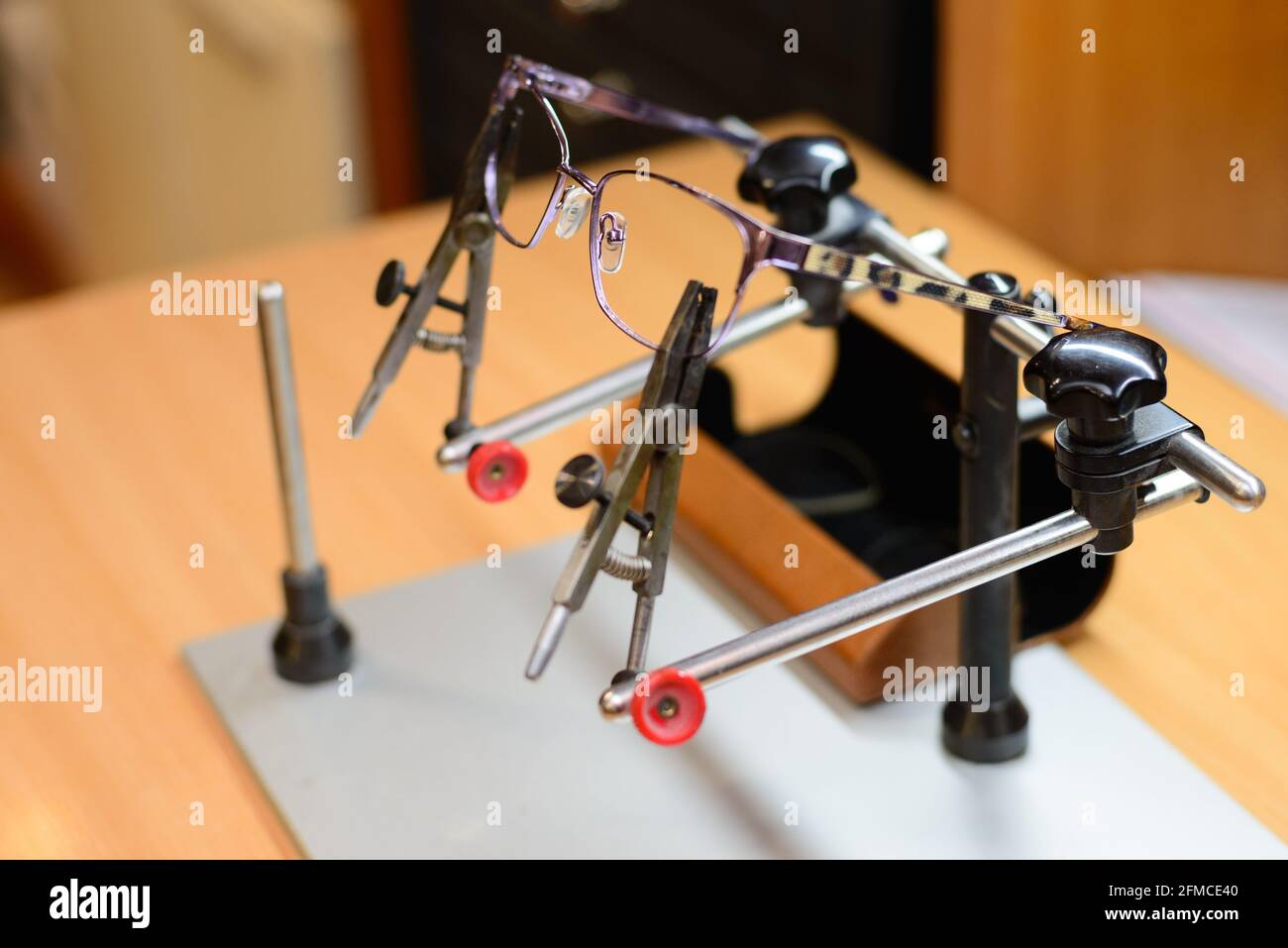 Close up photo of reading glasses being ready for repair while being