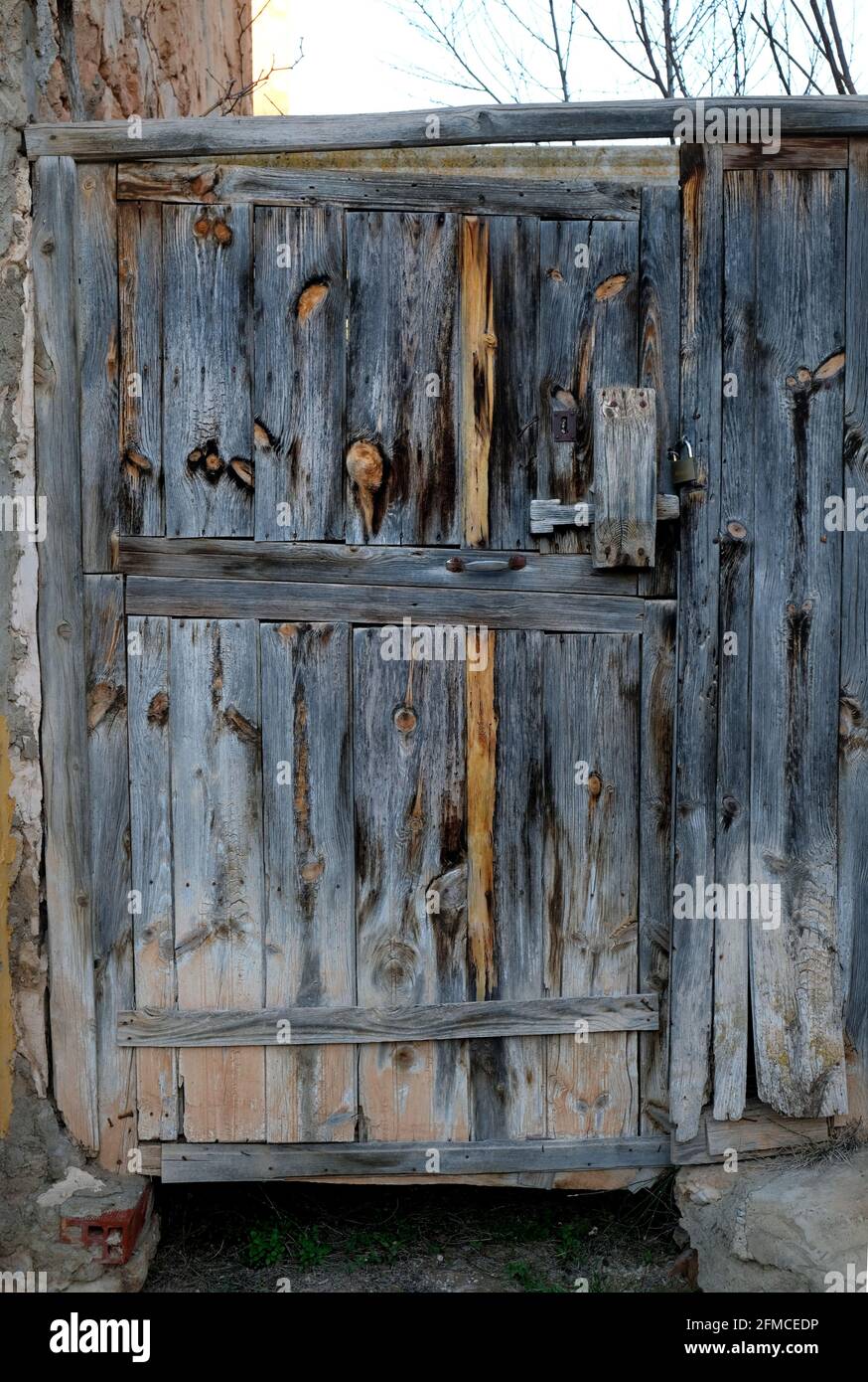 An old and delapidated back door in the village of Torrebaja in Valancia, Spain Stock Photo
