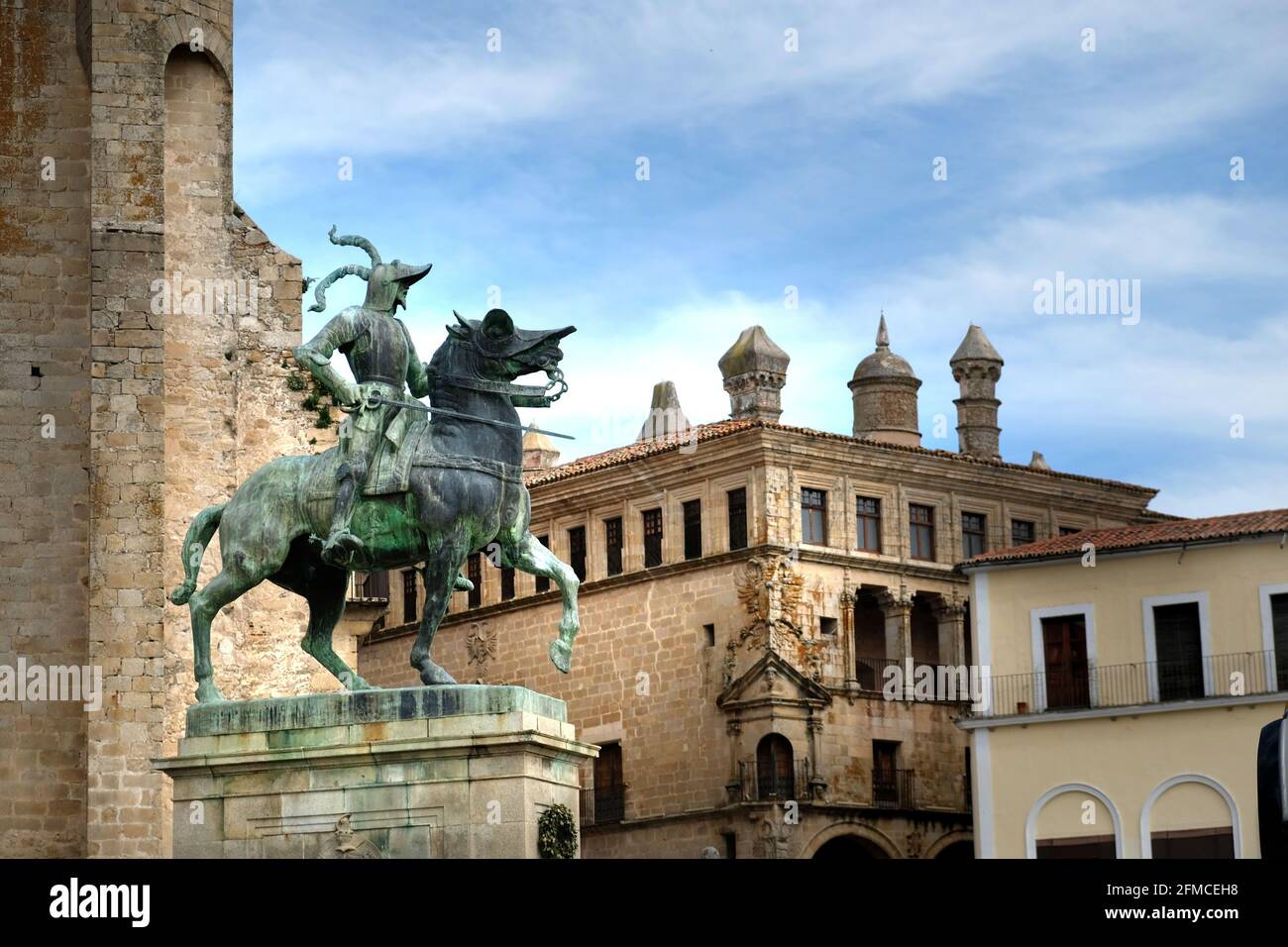 The equestrian statue of conquistador Francisco Pizarro González, Plaza Mayor, Trujillo, Cáceres, Extramadura, Spain. Palacio de San Carlos behind Stock Photo