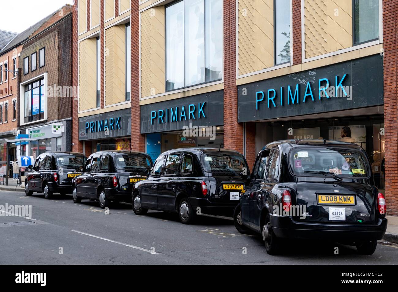 Kingston Upon Thames London UK, May 07 2021, Black London Taxis Parked  Outside A Primark Department Store In A Town Centre High Street Stock Photo  - Alamy