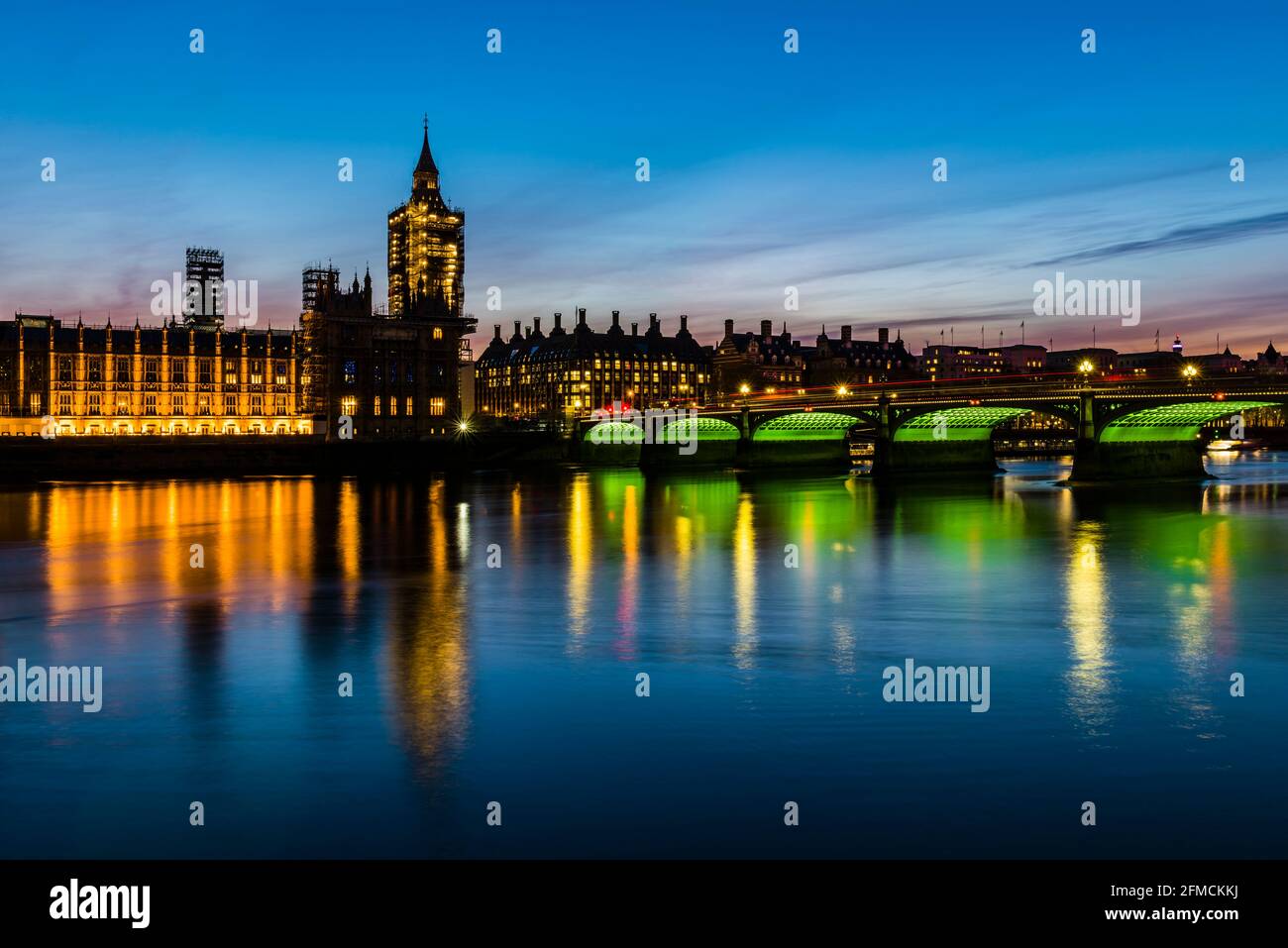 Lights and reflections at the Houses of Parliament and Westminster Bridge at dusk, London, UK Stock Photo
