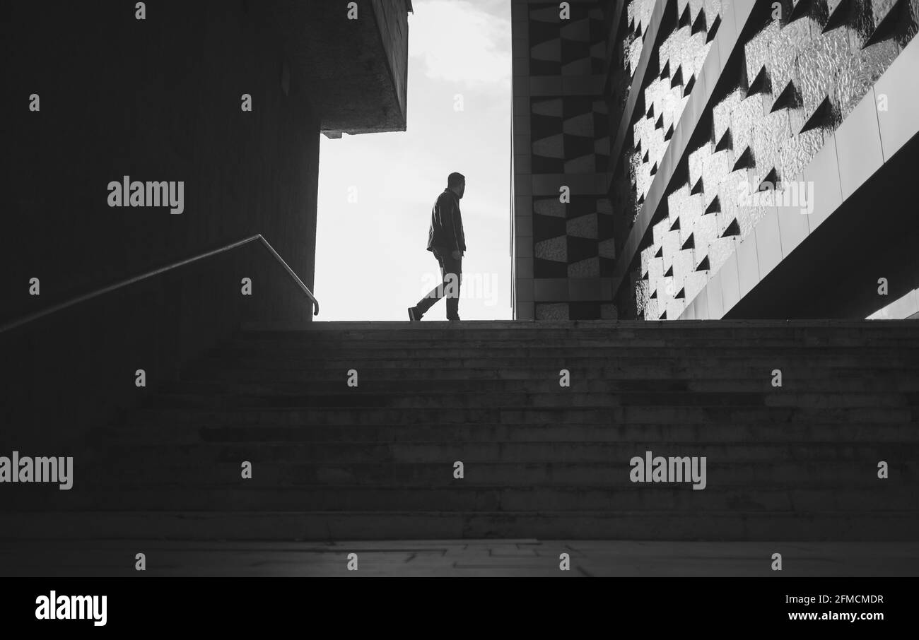 Black man walking inner city hi-res stock photography and images - Alamy