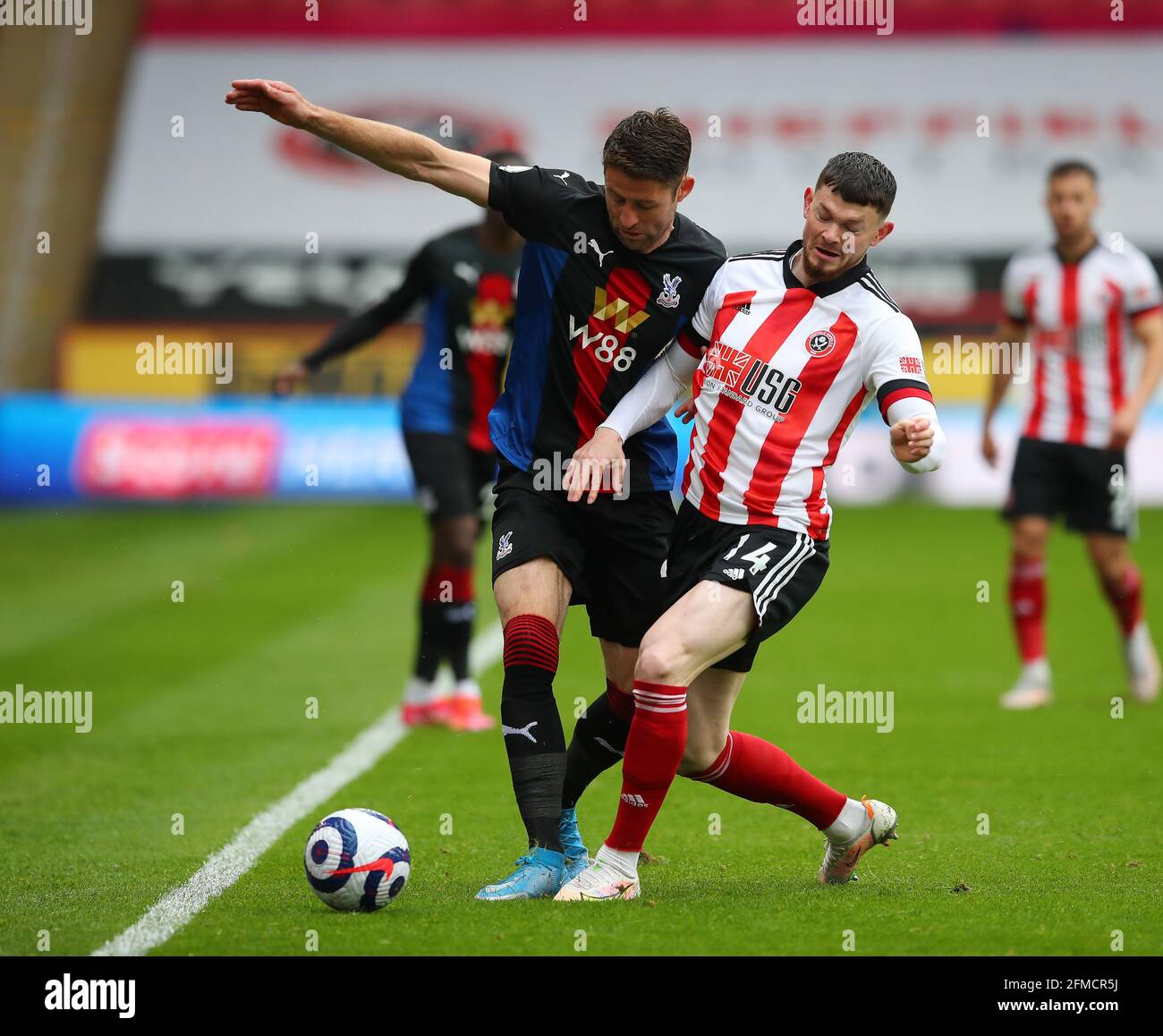 Sheffield, UK. 8th May 2021. Oliver Burke of Sheffield Utd tussles with Gary Cahill of Crystal Palace during the Premier League match at Bramall Lane, Sheffield. Picture credit should read: Simon Bellis/ Sportimage Stock Photo