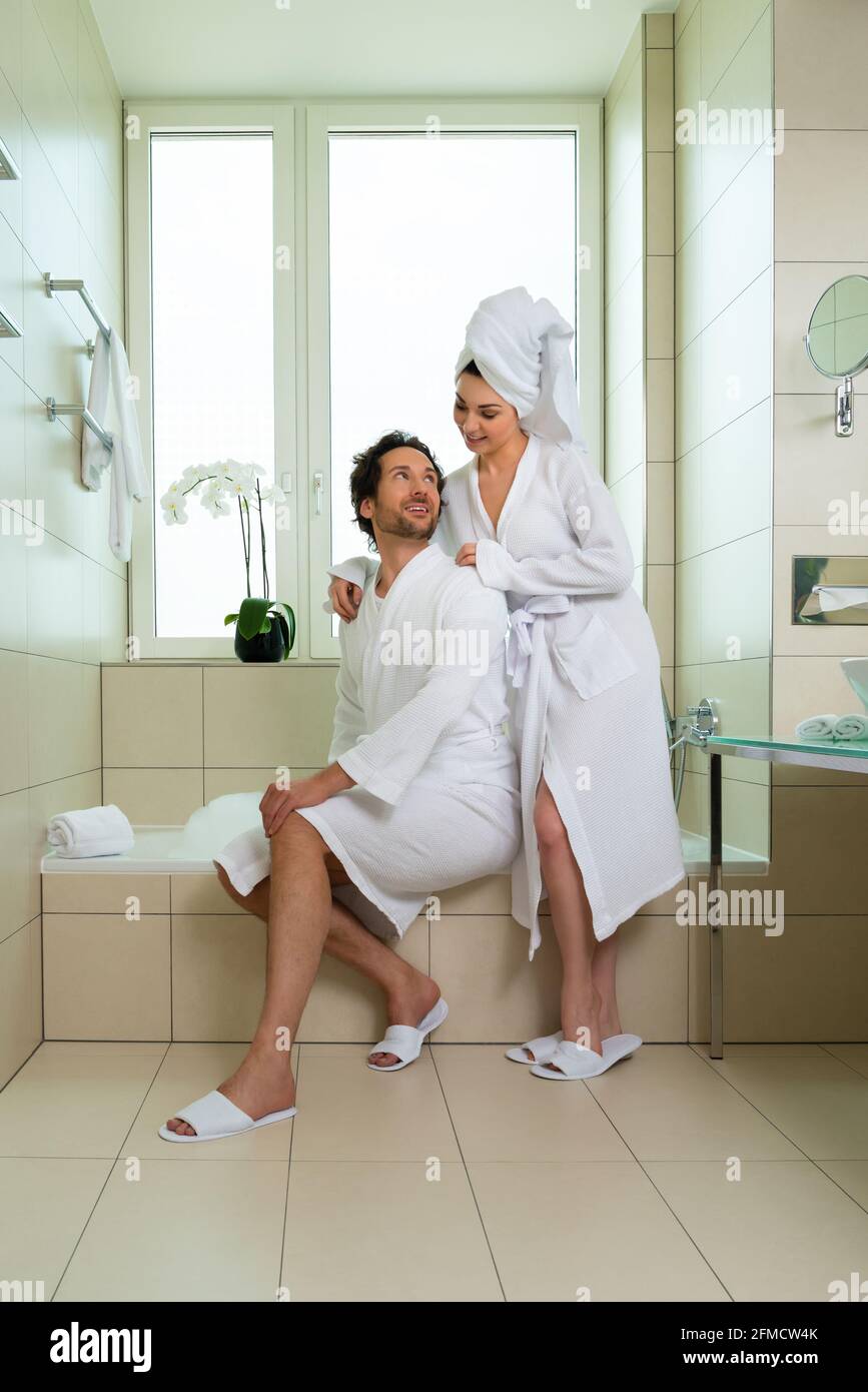 Young couple in bathroom of hotel making a bubble bath Stock Photo Alamy