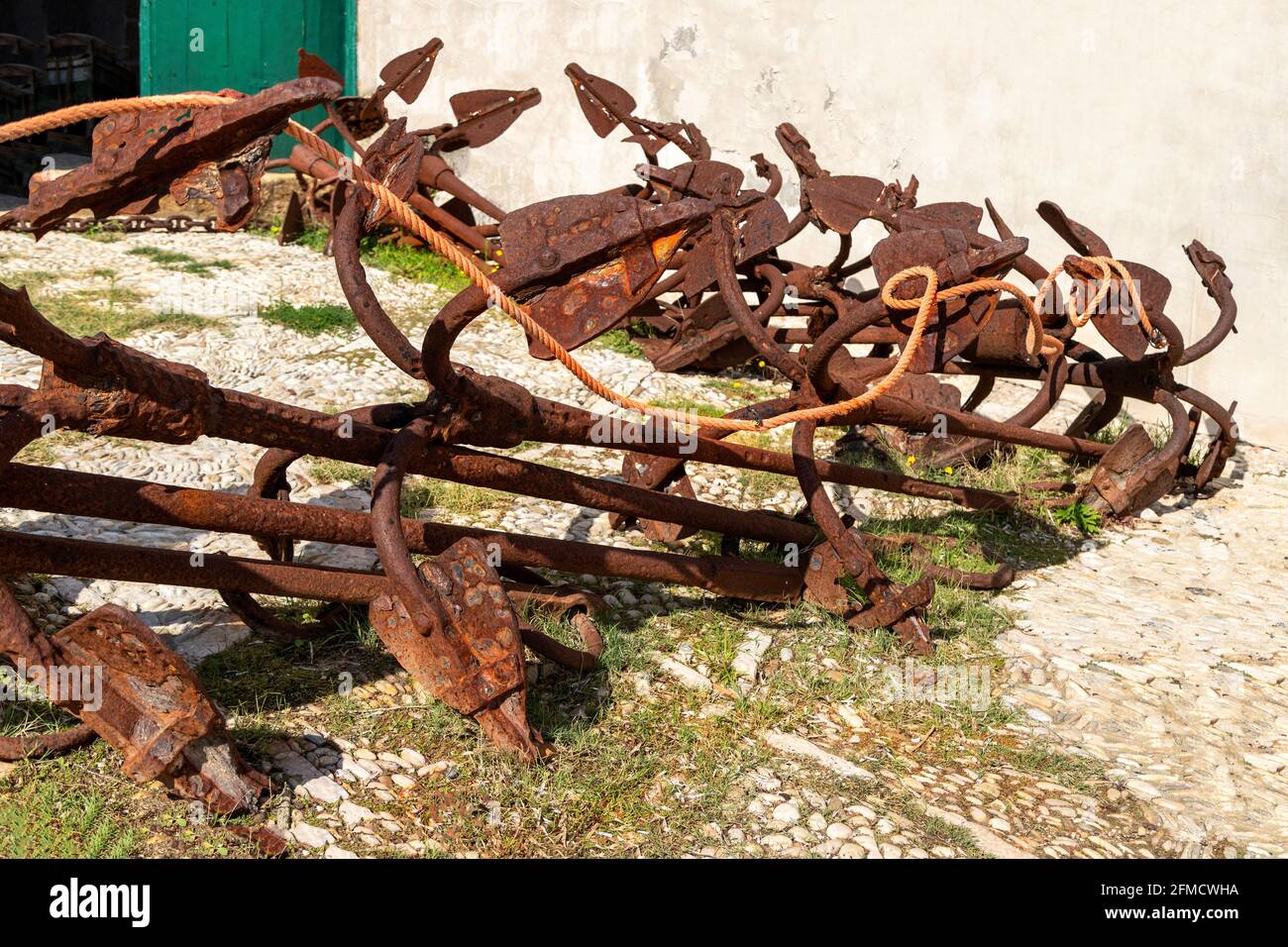 Rusty anchors at Tonnara di Scopello, a former location of tuna fishery, Scopello, Trapani province, Sicily, Italy. Stock Photo