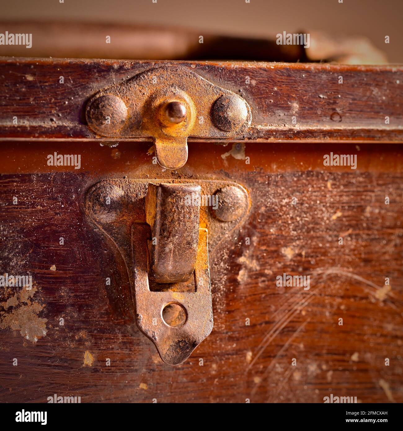 Rusting metal clasp and handle on old tin box Stock Photo