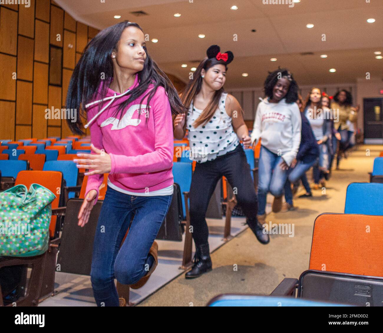 Students rehearsing for a show in the school auditorium Stock Photo