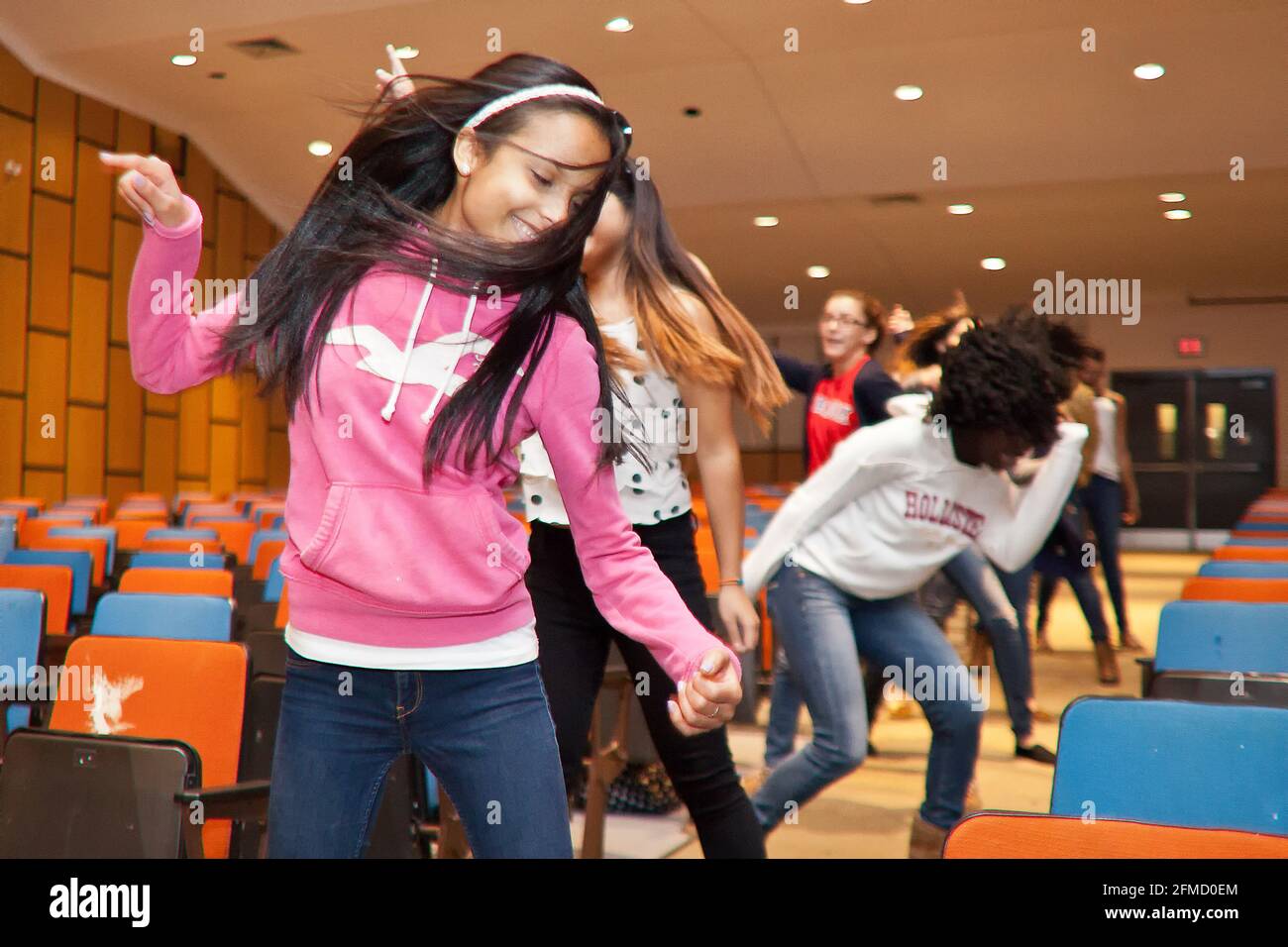 Students rehearsing for a show in the school auditorium Stock Photo