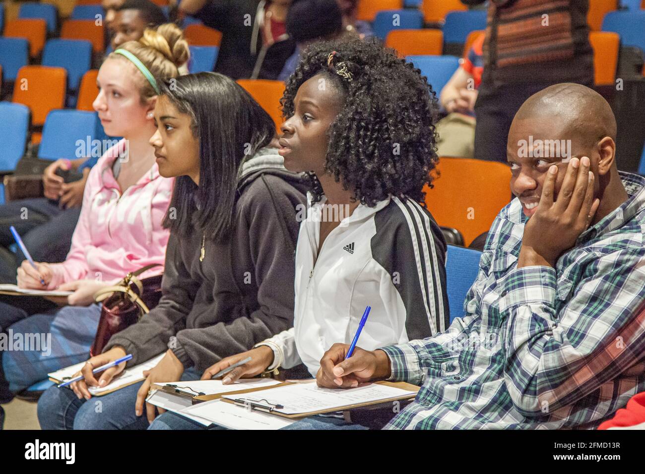 Students listening to a lecture in an auditorium Stock Photo