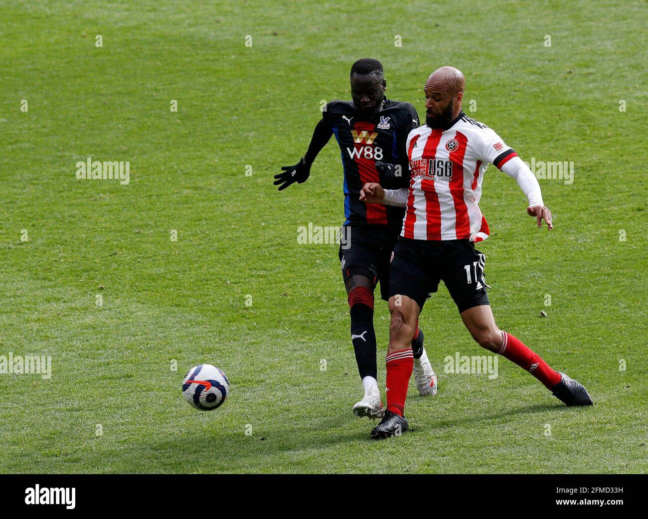 Sheffield, England, 8th May 2021. David McGoldrick of Sheffield Utd with Chikhou Kouyate of Crystal Palace during the Premier League match at Bramall Lane, Sheffield. Picture credit should read: Darren Staples / Sportimage Stock Photo