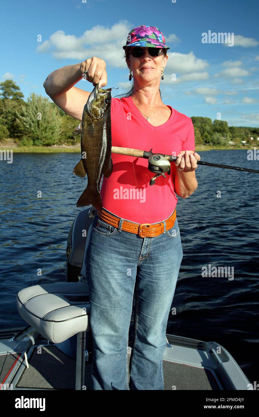 a woman with a nice bass fish Stock Photo