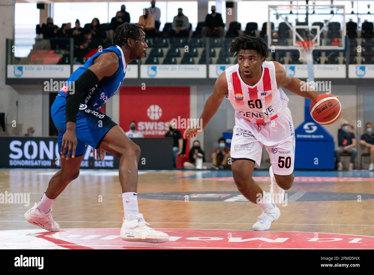 08.05.2021, Friborg, St-Leonard di Friborgo, Patrick Baumann Swiss Cup Men:  Lions de Geneve - Friborg Olympic, Am Ball Andre Williamson (Geneva)  against # 1 Boris Mbala (Friborg) (Photo by Til Buergy/Just Pictures/Sipa