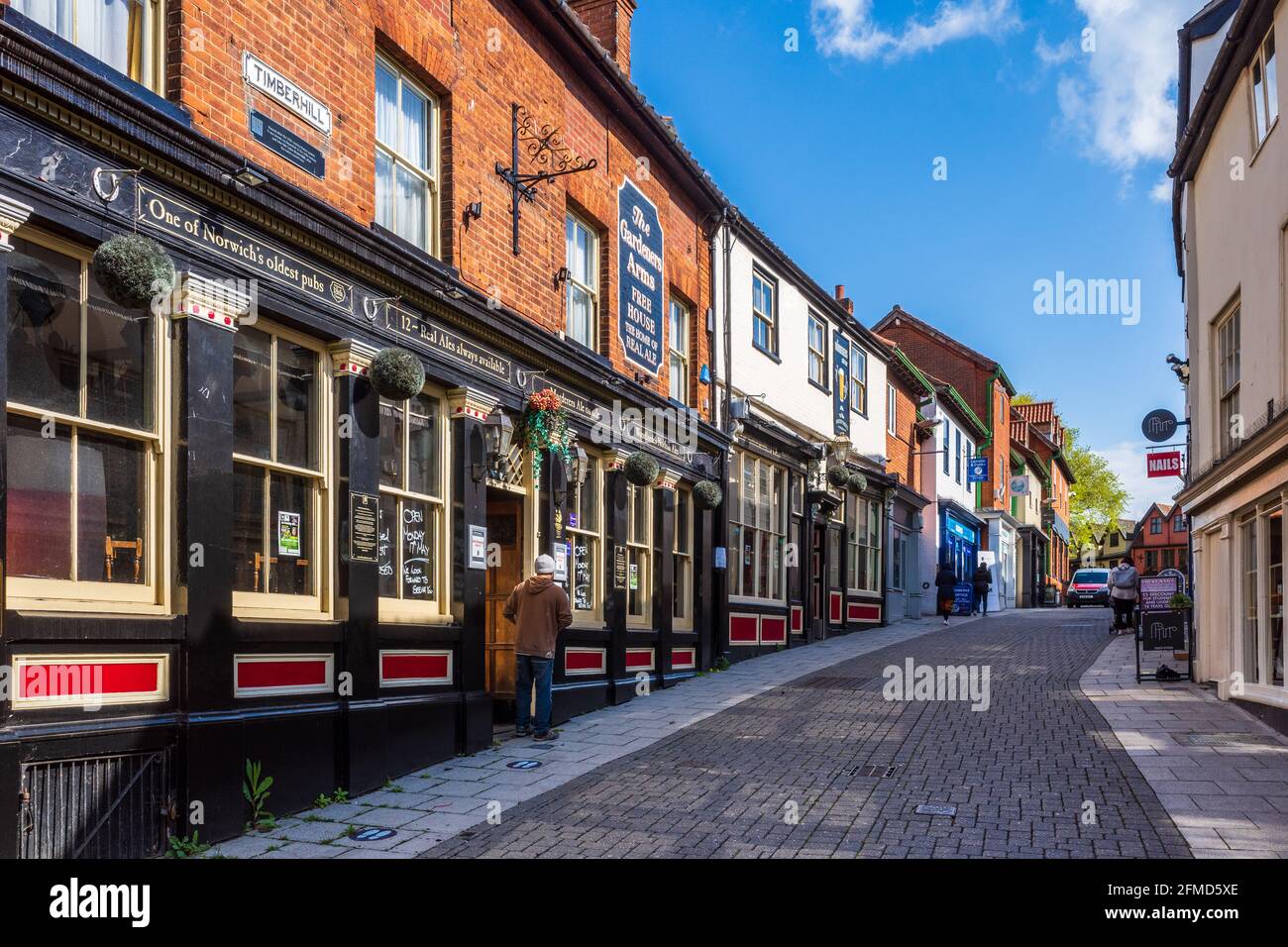 TimberHill Norwich or Timber Hill Norwich. One of the oldest recorded Norwich city streets. Damaged in the blitz 1942 but rebuilt. The Murderers Pub. Stock Photo