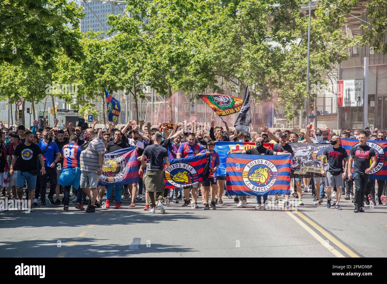 Barcelona, Spain. 08th May, 2021. Soccer Club Barcelona fans hold ultras flags. The ultras supporter group of Football Club Barcelona, Boixos Nois (Crazy Boys) have gathered outside the Camp Nou stadium to motivate the team before the match against Club Atletico de Madrid for the 35th round of La Liga, the Spanish football league. Barça's victory will put the team, currently in third place, ahead of Atletico de Madrid, which occupies the first position. Credit: SOPA Images Limited/Alamy Live News Stock Photo