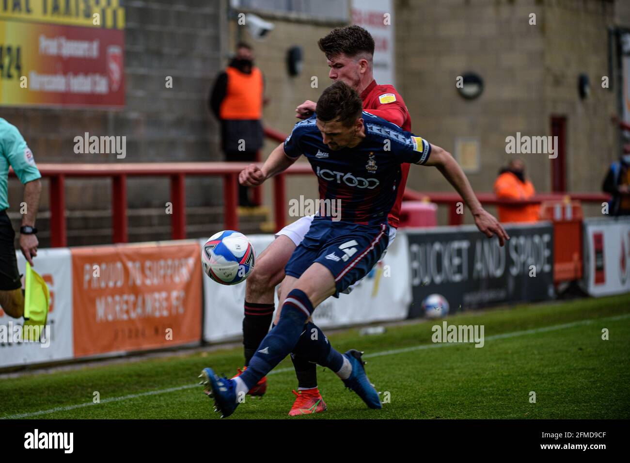 MORECAMBE, UK. MAY 8TH. Paudie O'Connor of Bradford City FC tackles Liam McAlinden of Morecambe FC during the Sky Bet League 2 match between Morecambe and Bradford City at the Globe Arena, Morecambe on Saturday 8th May 2021. (Credit: Ian Charles | MI News) Credit: MI News & Sport /Alamy Live News Stock Photo