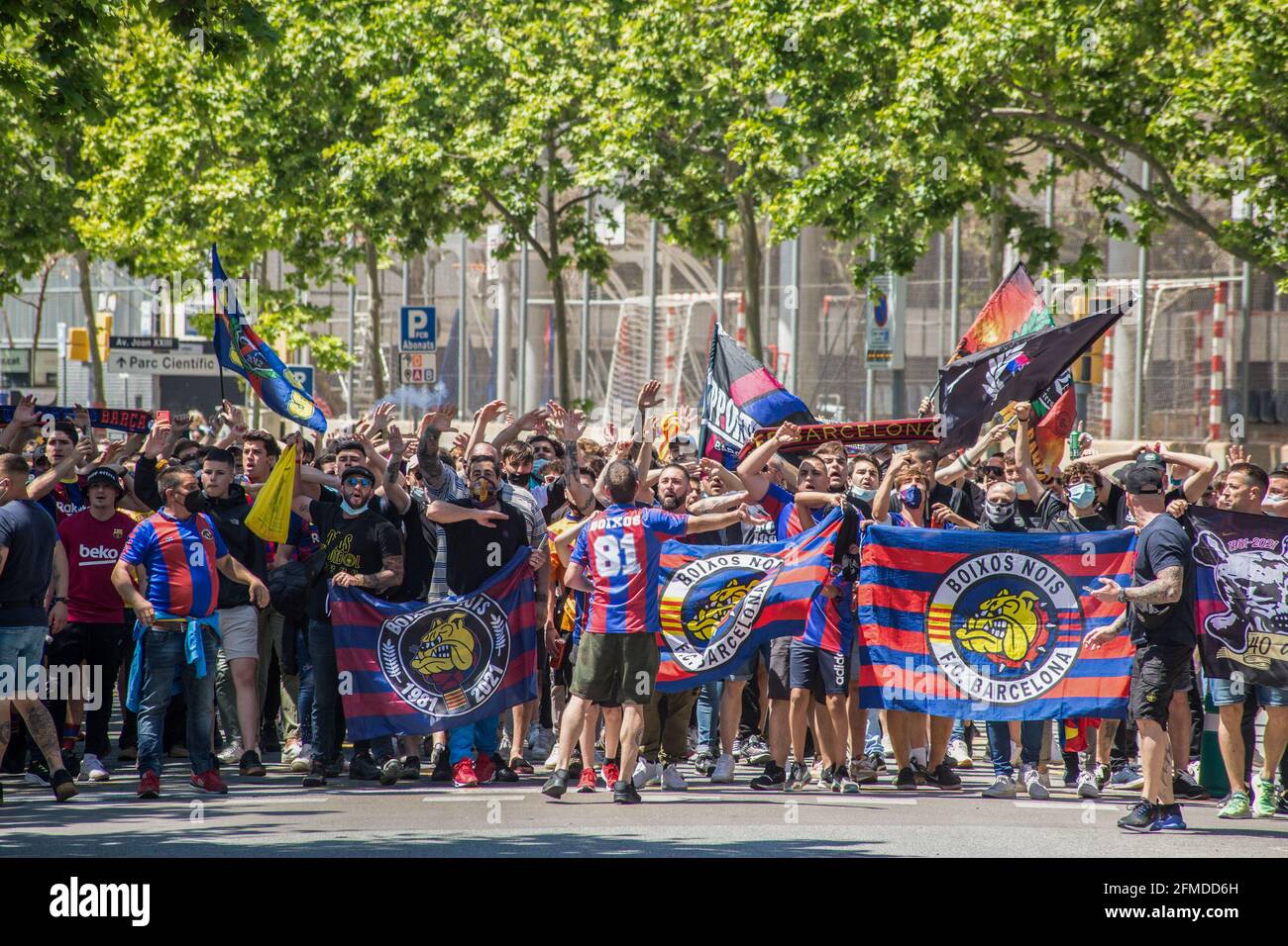 Barcelona, Spain. 08th May, 2021. Soccer Club Barcelona fans hold ultras flags. The ultras supporter group of Football Club Barcelona, Boixos Nois (Crazy Boys) have gathered outside the Camp Nou stadium to motivate the team before the match against Club Atletico de Madrid for the 35th round of La Liga, the Spanish football league. Barça's victory will put the team, currently in third place, ahead of Atletico de Madrid, which occupies the first position. (Photo by Thiago Prudencio/SOPA Images/Sipa USA) Credit: Sipa USA/Alamy Live News Stock Photo