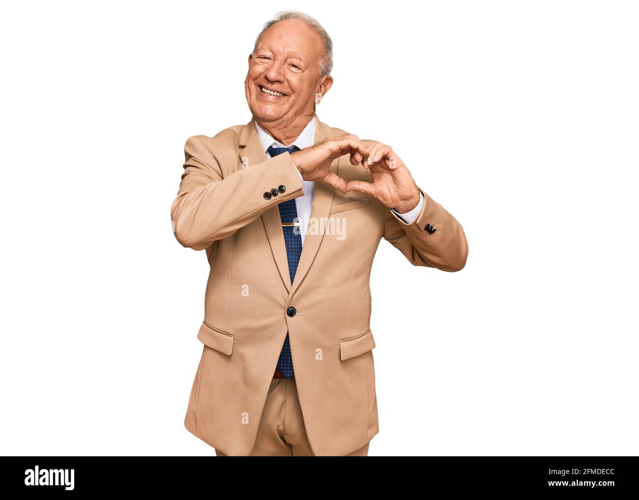 Senior caucasian man wearing business suit and tie smiling in love ...