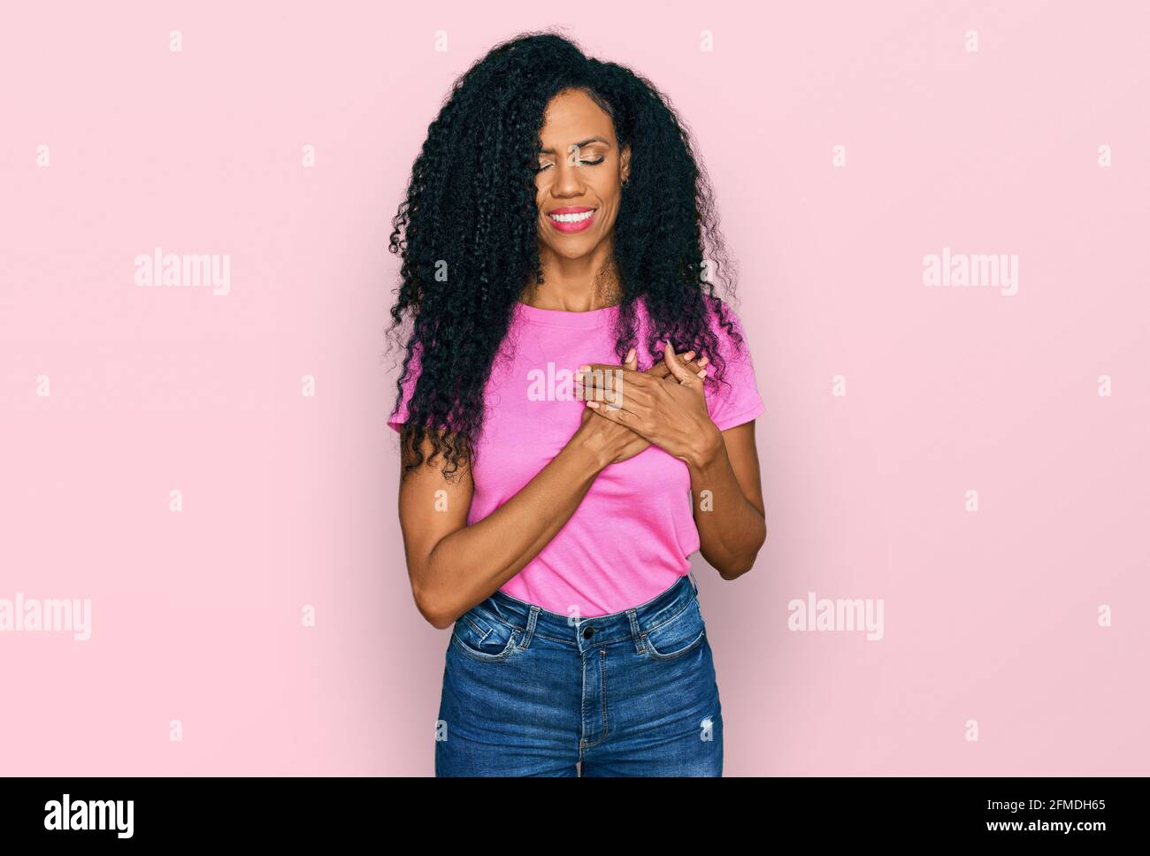Middle age african american woman wearing casual clothes smiling with ...