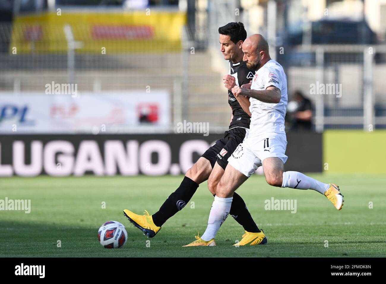 Lugano, Switzerland. 08th May, 2021. Miroslav Covilo (#6 FC Lugano) and  Tunahan Cicek (#11 FC Vaduz) during the Swiss Super League match between FC  Lugano and FC Vaduz at Cornaredo Stadium in