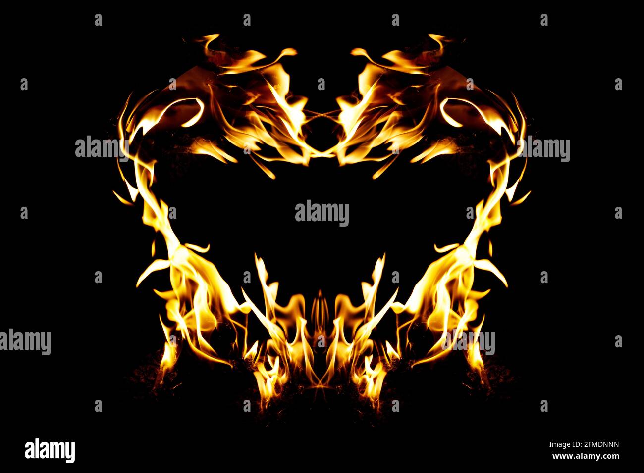 Abstract love shape or love fire frame design with fire flame on black background Stock Photo