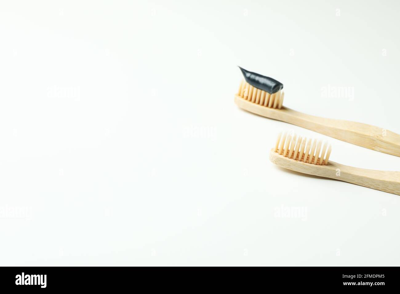 Eco friendly wooden toothbrushes on white background Stock Photo - Alamy