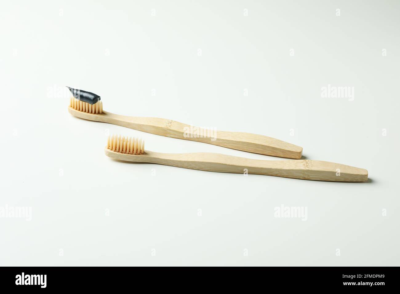 Eco friendly wooden toothbrushes on white background Stock Photo - Alamy