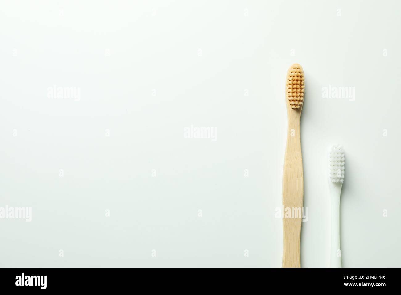 Eco friendly wooden toothbrushes on white background Stock Photo - Alamy