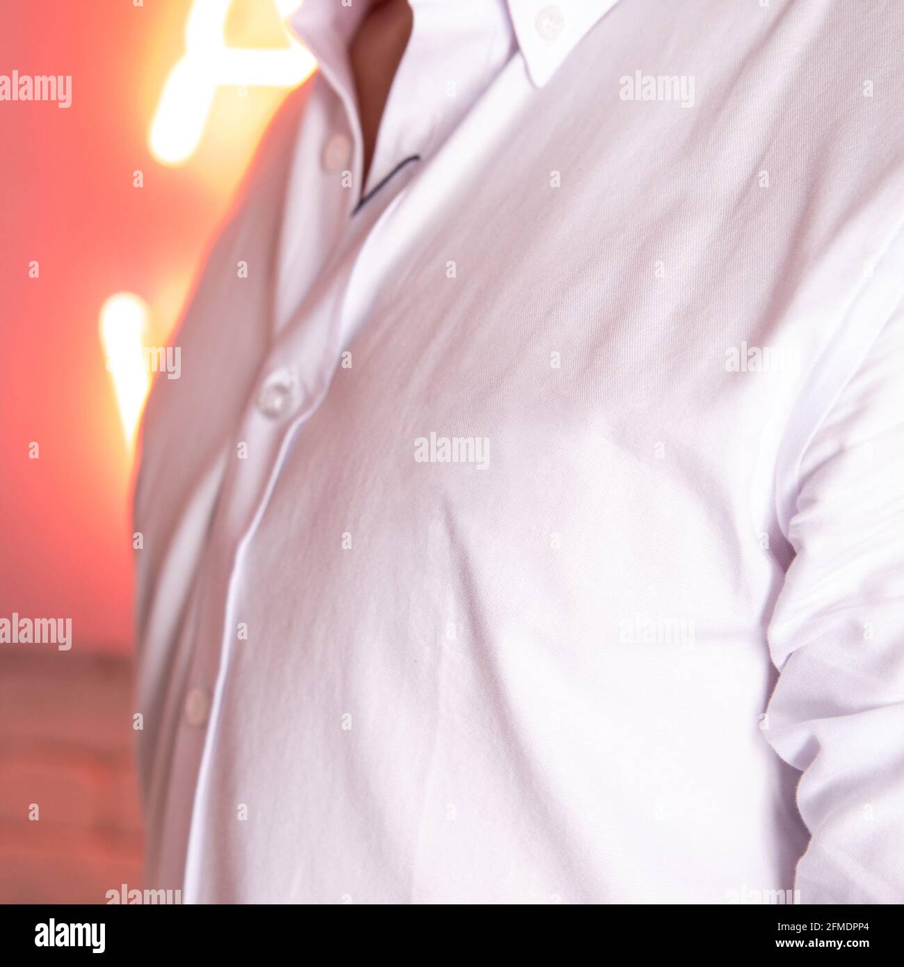 white men's shirt closeup against the white brick wall Stock Photo Alamy