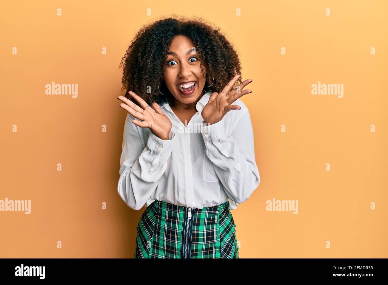 Beautiful African American Woman With Afro Hair Wearing Scholar Skirt 