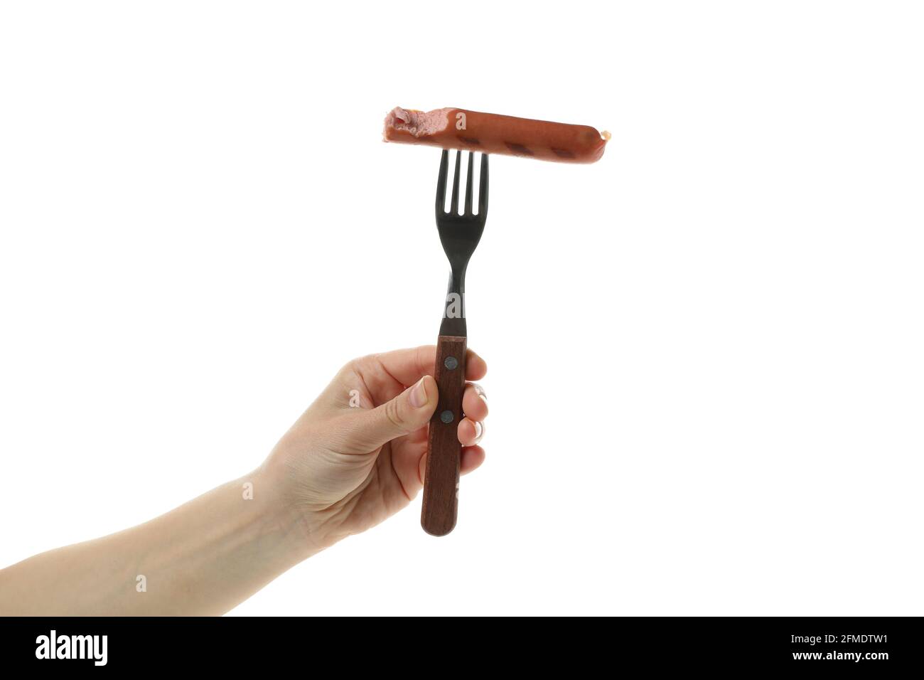 Female hand hold fork with grilled sausage, isolated on white background Stock Photo