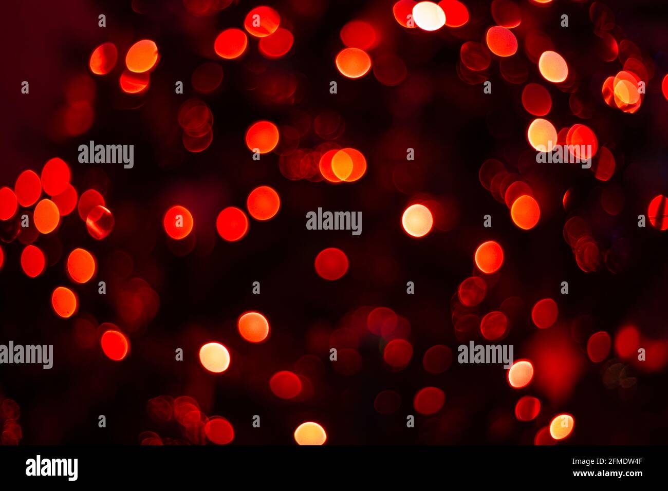 Various blurry red lights on black background. Stock Photo