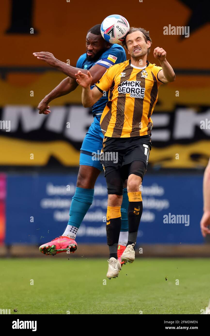 Abbey Stadium, Cambridge, Cambridgeshire, UK. 8th May, 2021. English Football League Two Football, Cambridge United versus Grimsby Town; Harrison Dunk of Cambridge Utd competes for the ball with Lenell John-Lewis of Grimsby Town Credit: Action Plus Sports/Alamy Live News Stock Photo