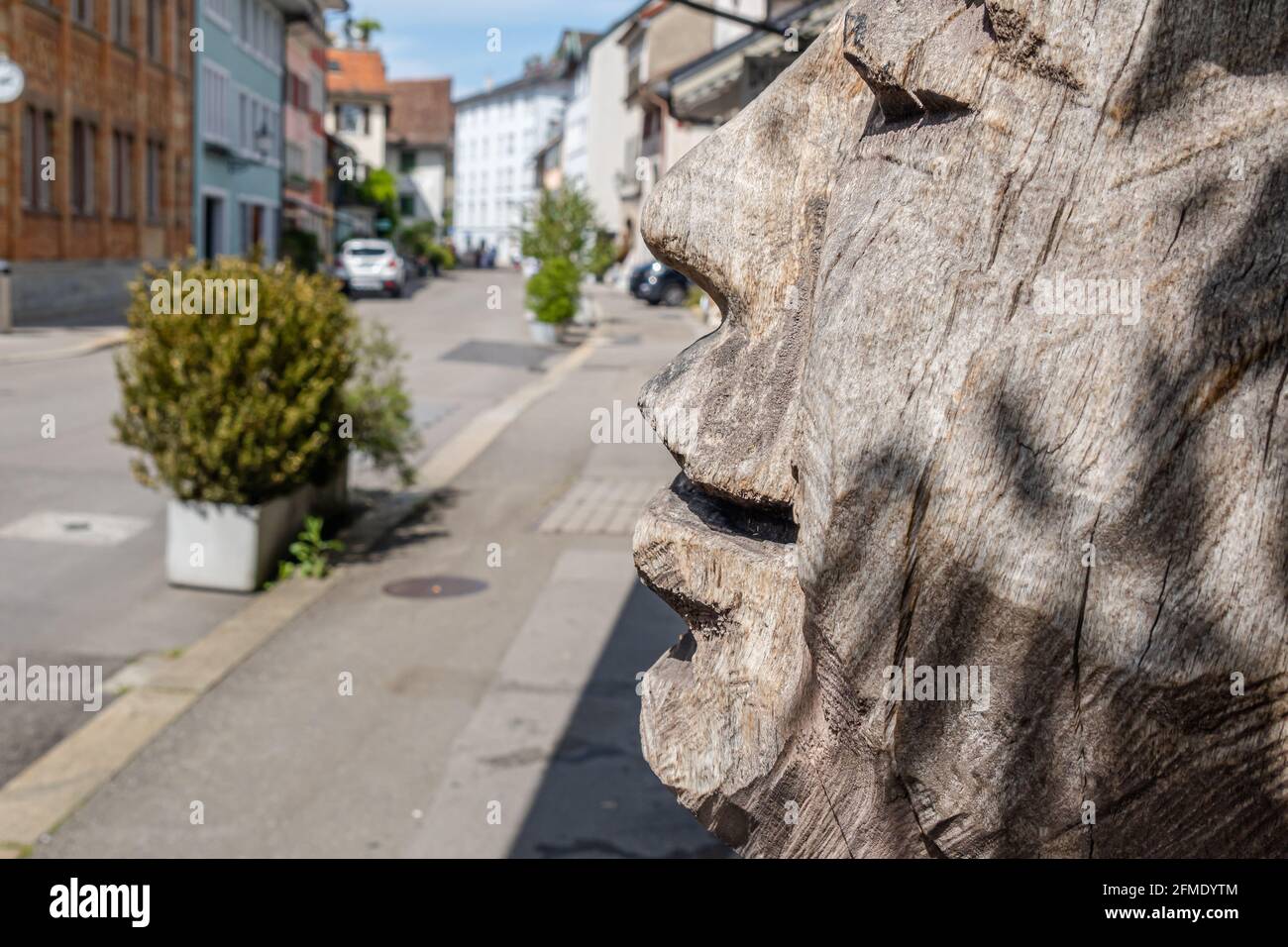 Winterthur, Switzerland - May 7, 2020: Decorative wooden sculpture of a human face Stock Photo