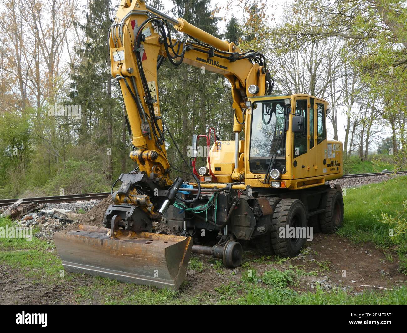 Ringe, Germany - May 8 2021 An Atlas excavator. It's the weekend, so no  workers. The machine is made to drive on rails and roads Stock Photo - Alamy