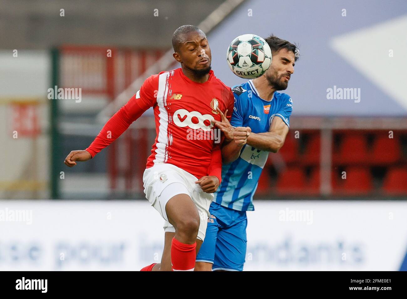 Standard's Samuel Bastien and Gent's Milad Mohammadi fight for the ball during a soccer match between Standard de Liege and KAA Gent, Saturday 08 May Stock Photo