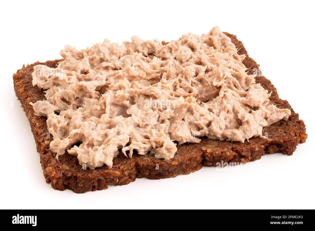 Tuna mayonnaise spread on German health bread isolated on white Stock